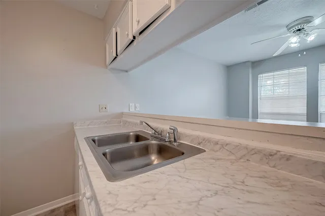 a bathroom with a sink and washing machine