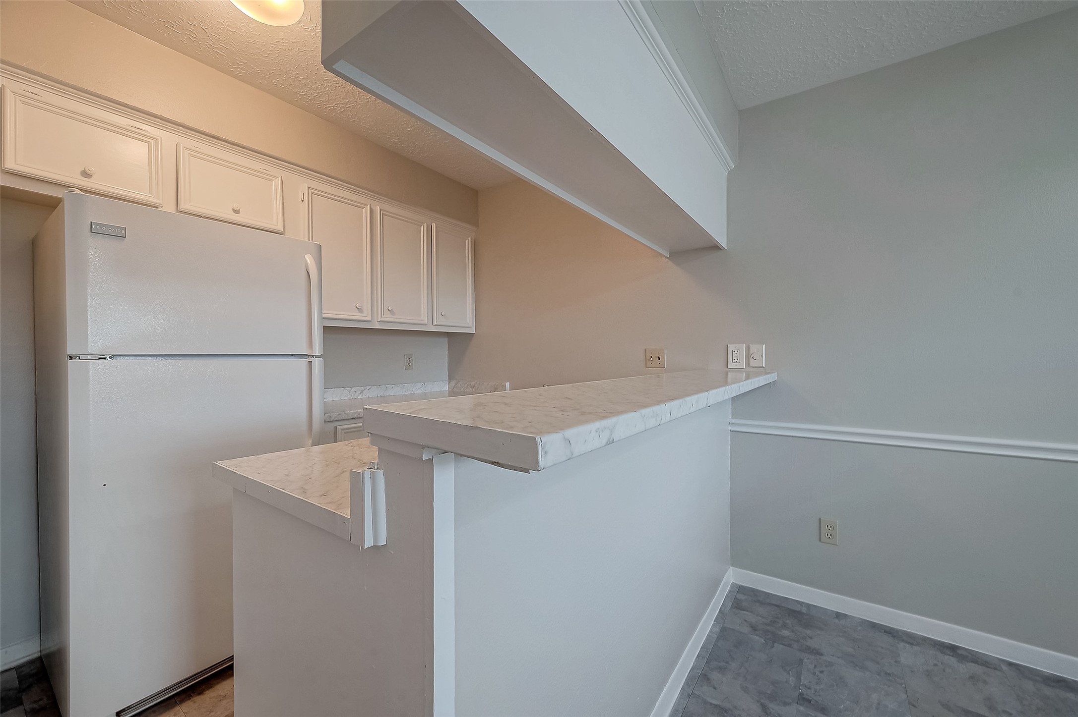 11503 Meadow Lane, Unit D Houston, TX 77477 - Photo 23 of 39 a view of storage and utility room with refrigerator