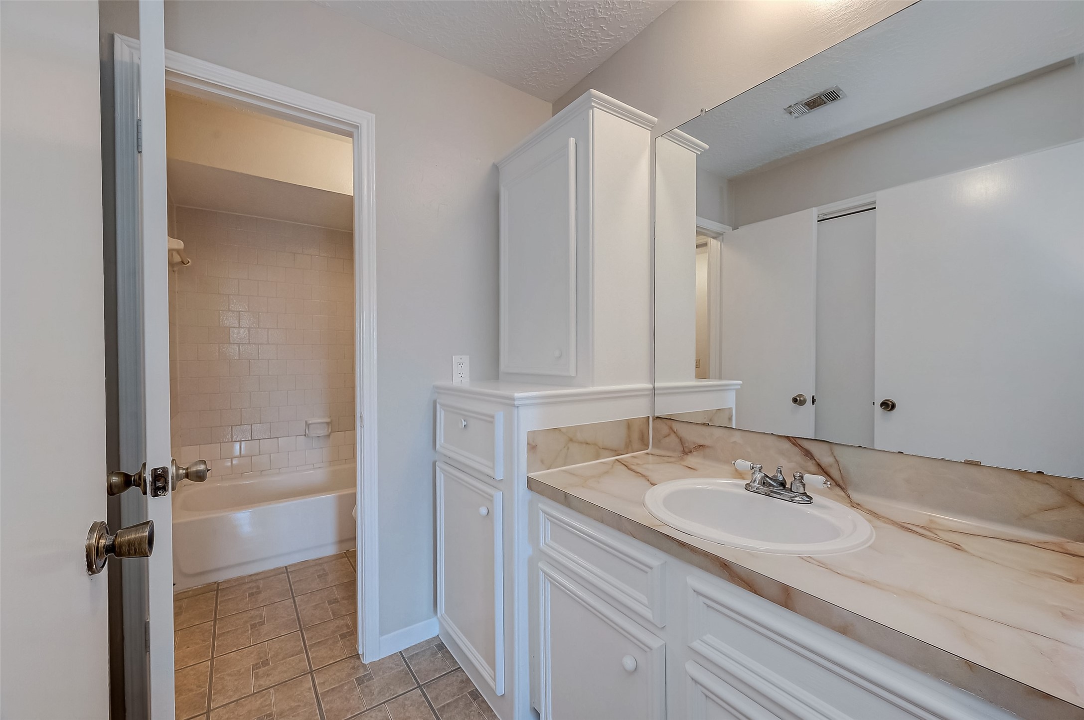 11503 Meadow Lane, Unit D Houston, TX 77477 - Photo 24 of 39 a bathroom with a sink and a mirror