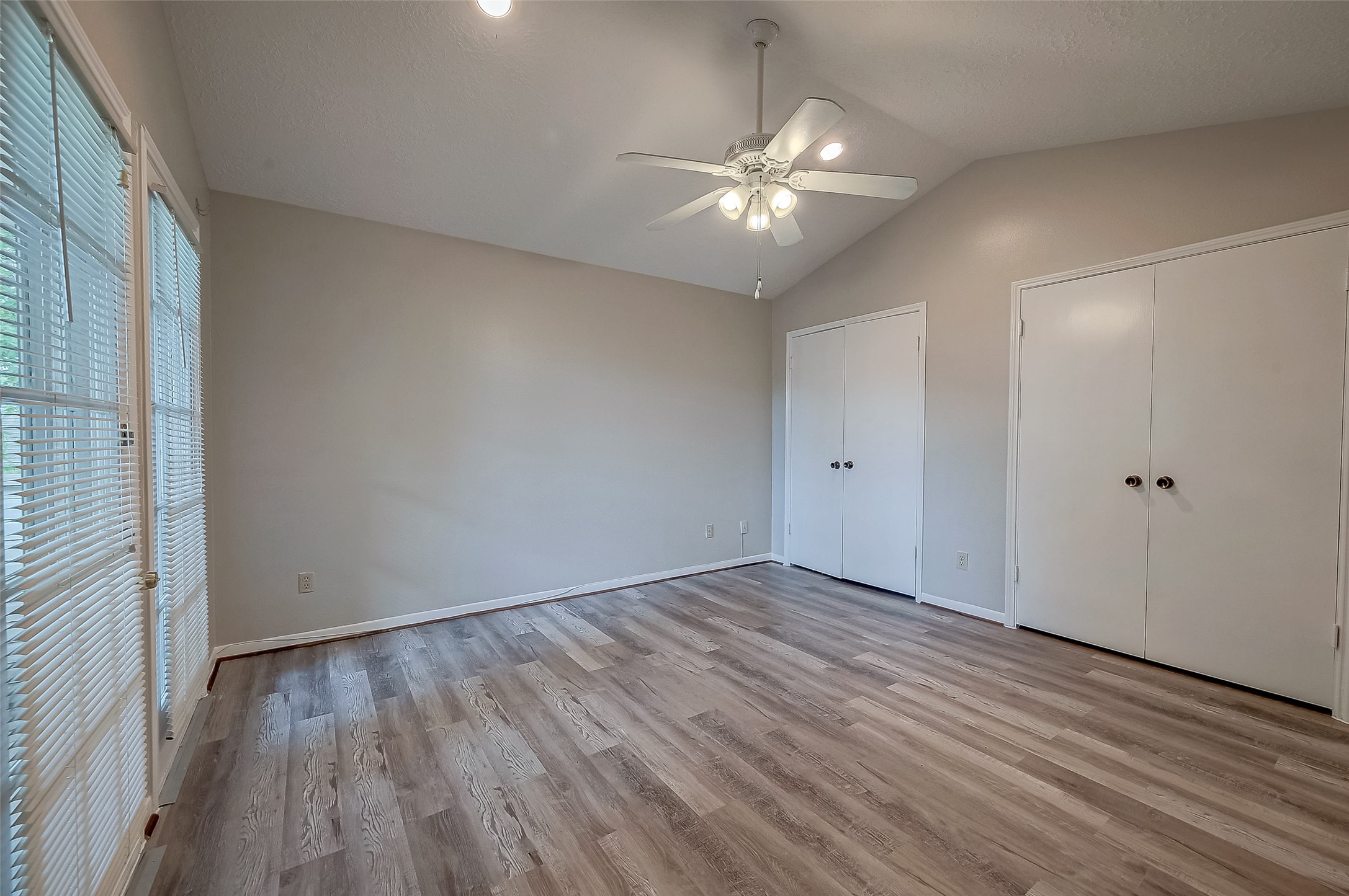 11503 Meadow Lane, Unit D Houston, TX 77477 - Photo 27 of 39 a view of an empty room with wooden floor