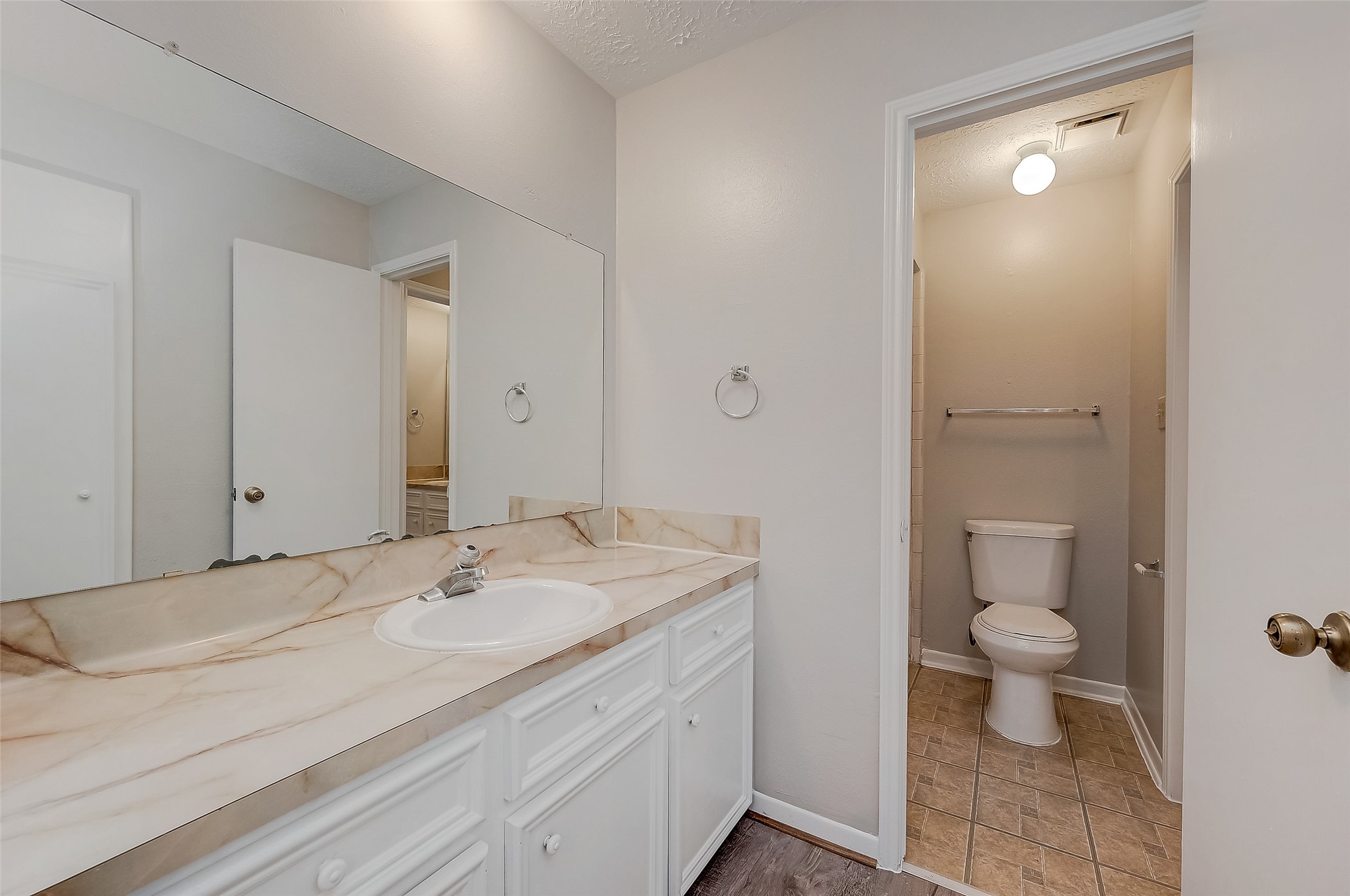 11503 Meadow Lane, Unit D Houston, TX 77477 - Photo 32 of 39 a bathroom with a sink a toilet and shower