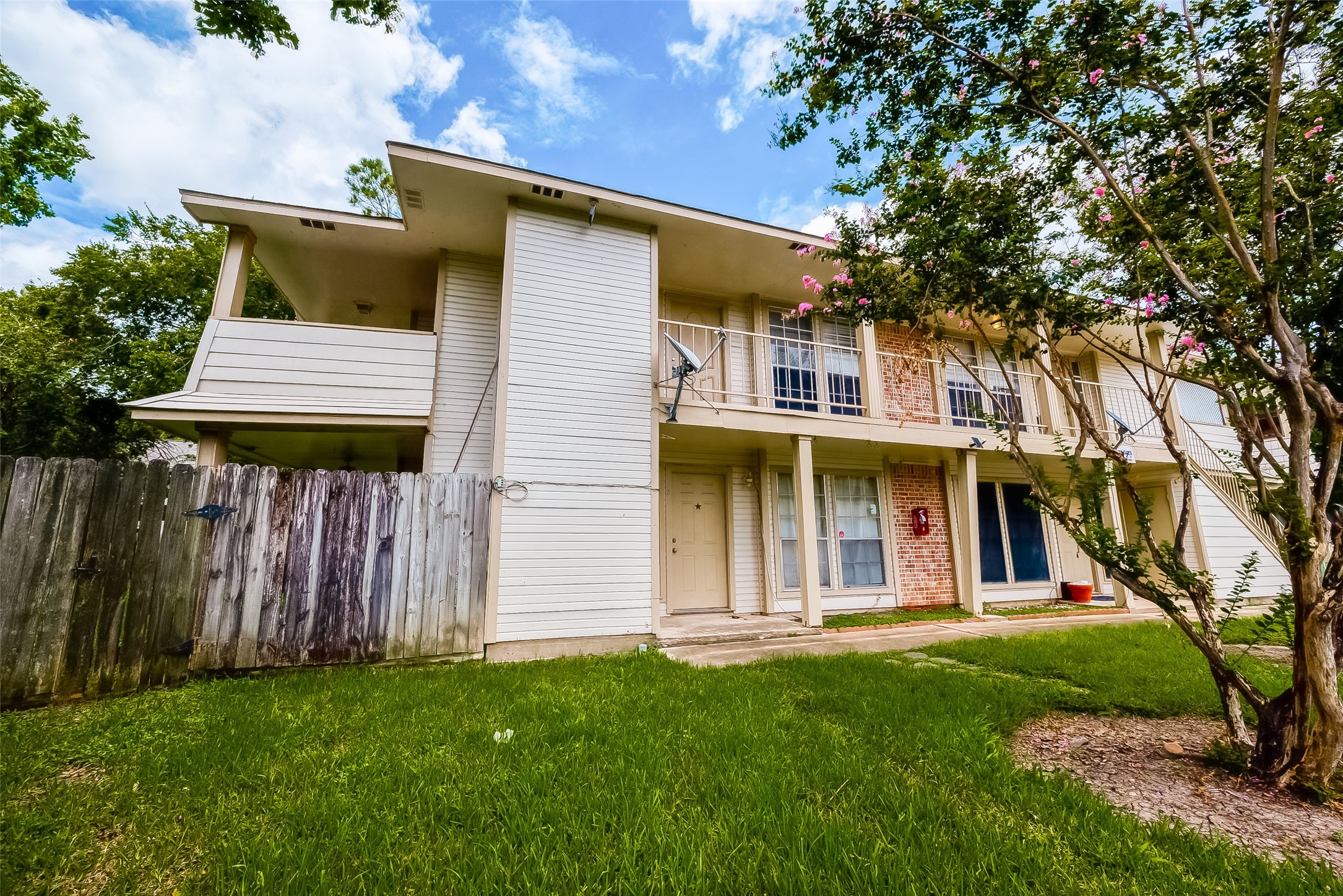 11503 Meadow Lane, Unit D Houston, TX 77477 - Photo 36 of 39 a front view of a house with a garden