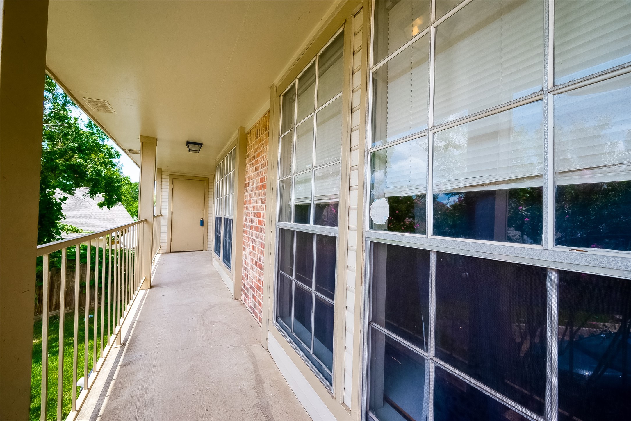 11503 Meadow Lane, Unit D Houston, TX 77477 - Photo 37 of 39 a view of a balcony with door