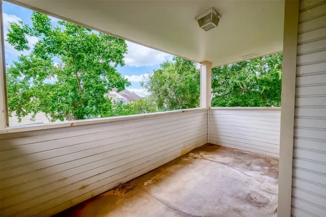 a view of a room with a large window
