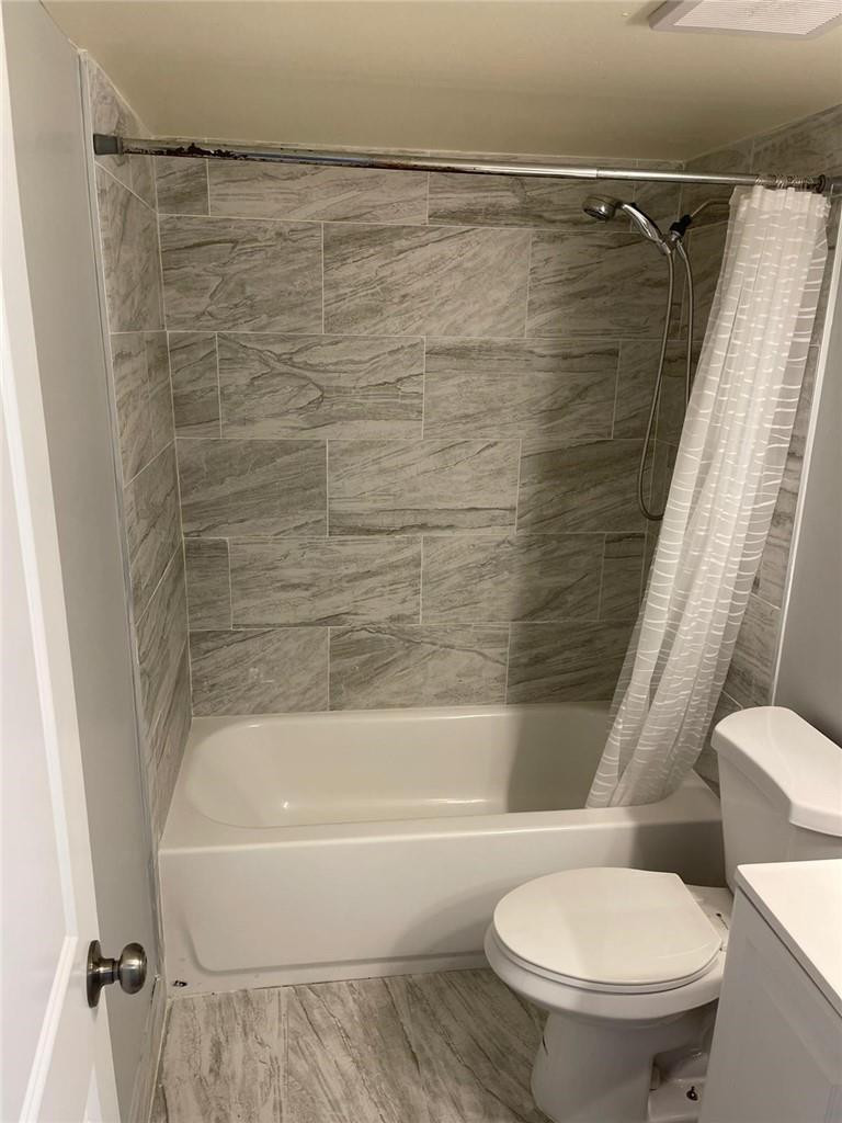 1112 North Hiatus Road, Unit 1112 Pembroke Pines, FL 33026 - Photo 12 of 48 a bathroom with a toilet and a bathtub