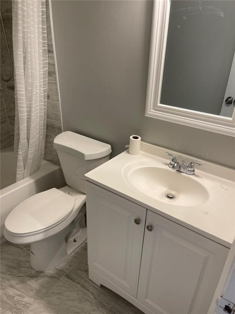 1112 North Hiatus Road, Unit 1112 Pembroke Pines, FL 33026 - Photo 13 of 48 a bathroom with a sink and a toilet