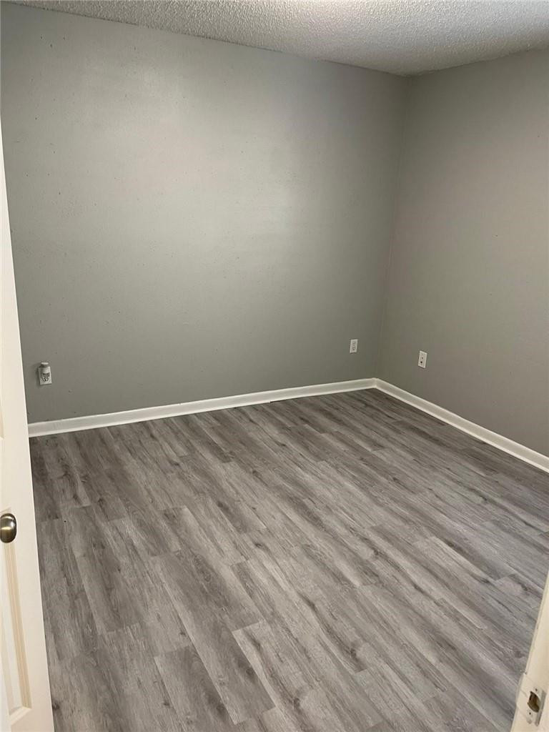 1112 North Hiatus Road, Unit 1112 Pembroke Pines, FL 33026 - Photo 16 of 48 a view of room with wooden floor