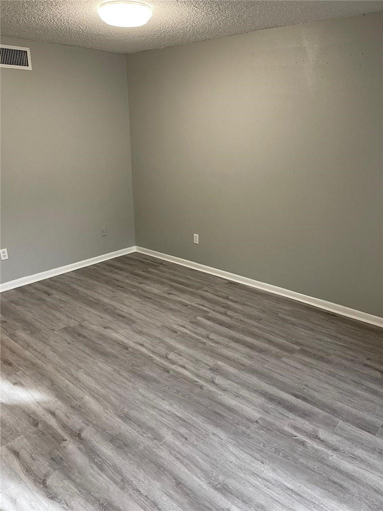 1112 North Hiatus Road, Unit 1112 Pembroke Pines, FL 33026 - Photo 22 of 48 a view of an empty room with wooden floor