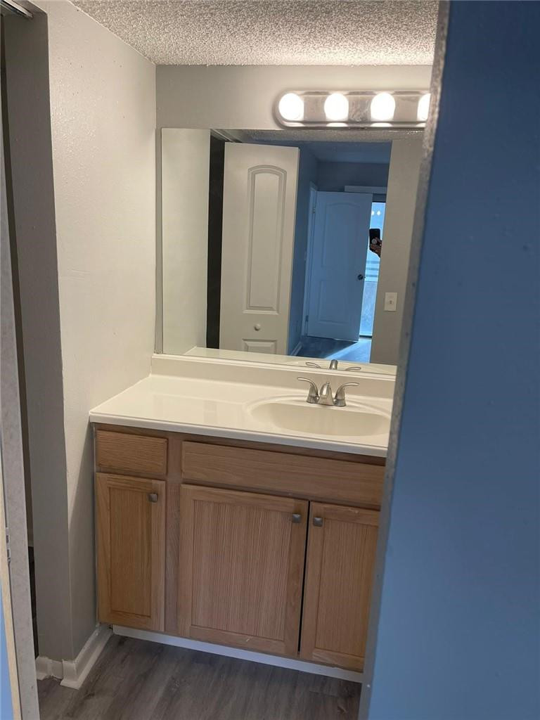1112 North Hiatus Road, Unit 1112 Pembroke Pines, FL 33026 - Photo 24 of 48 a bathroom with a sink and a mirror