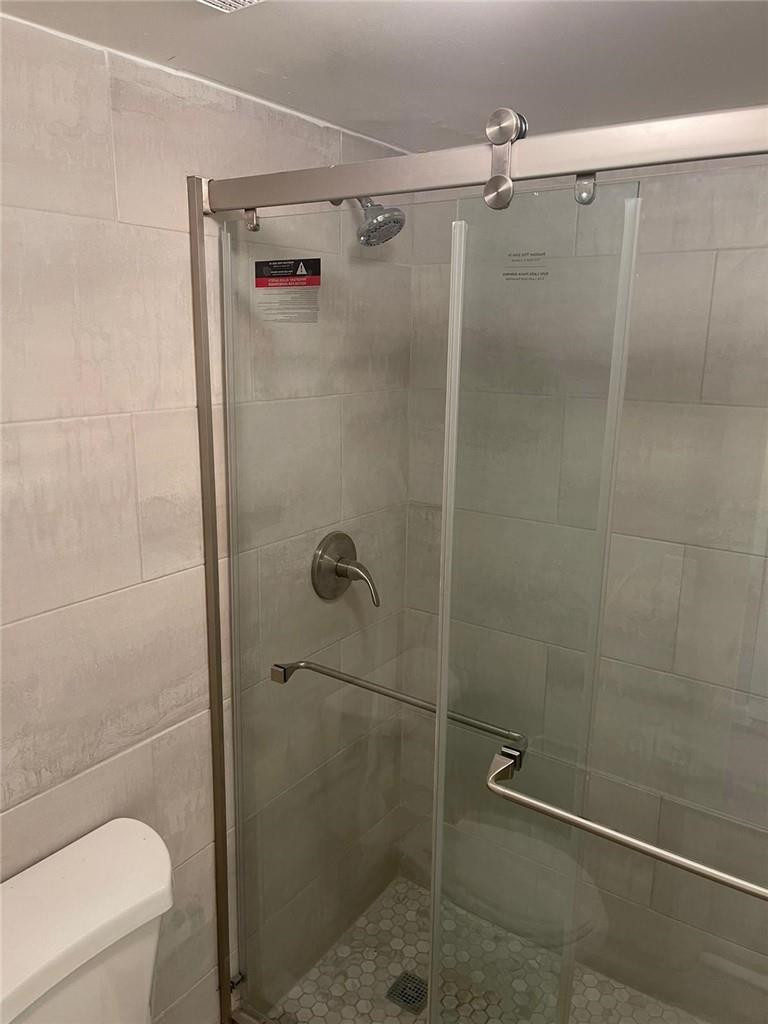 1112 North Hiatus Road, Unit 1112 Pembroke Pines, FL 33026 - Photo 27 of 48 a bathroom with a shower