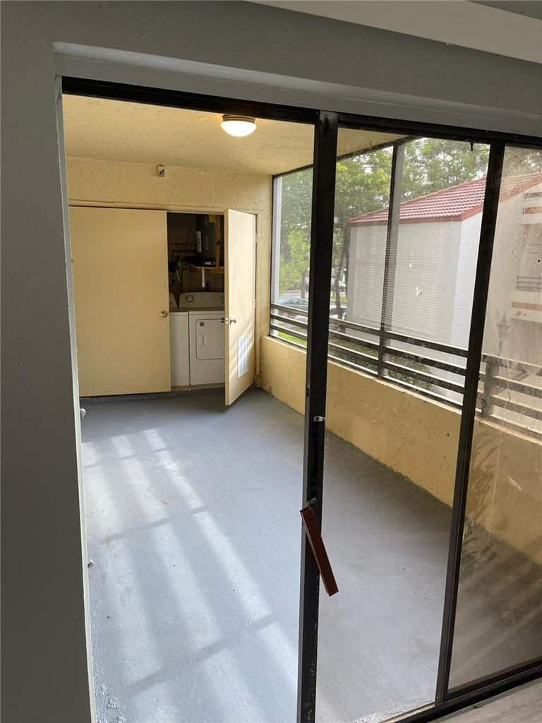 1112 North Hiatus Road, Unit 1112 Pembroke Pines, FL 33026 - Photo 32 of 48 a view of an empty room with a window
