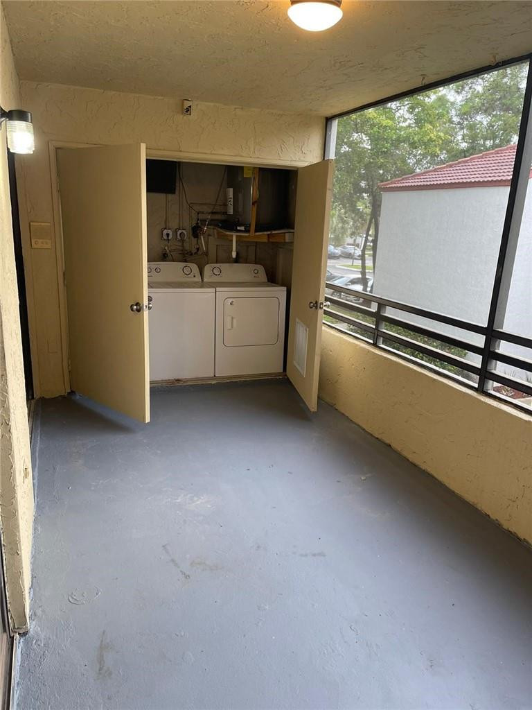1112 North Hiatus Road, Unit 1112 Pembroke Pines, FL 33026 - Photo 34 of 48 a kitchen with a sink stainless steel appliances and cabinets