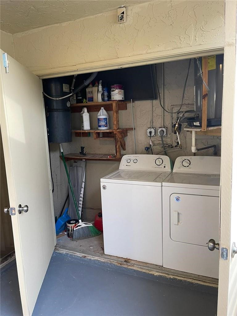 1112 North Hiatus Road, Unit 1112 Pembroke Pines, FL 33026 - Photo 35 of 48 a utility room with dryer and washer