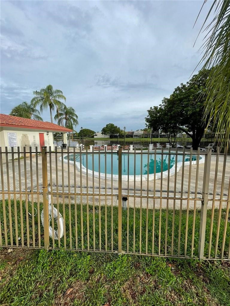 1112 North Hiatus Road, Unit 1112 Pembroke Pines, FL 33026 - Photo 46 of 48 a view of a wrought iron fences