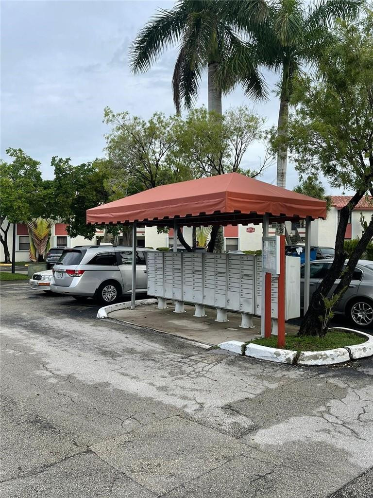 1112 North Hiatus Road, Unit 1112 Pembroke Pines, FL 33026 - Photo 47 of 48 a view of a street with cars parked