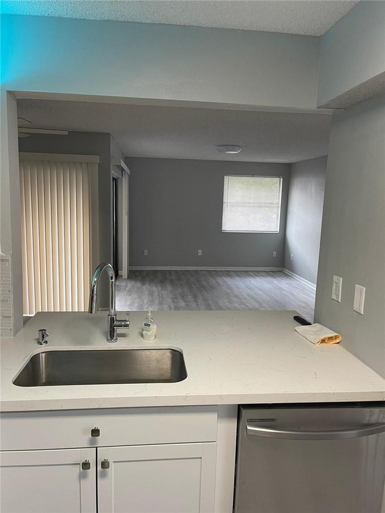 1112 North Hiatus Road, Unit 1112 Pembroke Pines, FL 33026 - Photo 5 of 48 a sink with a bench