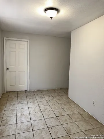 an empty room with white walls