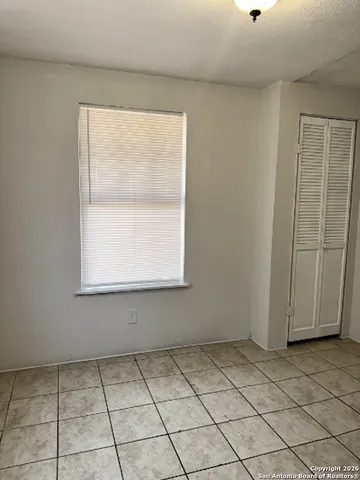 a bathroom with a sink toilet and a mirror