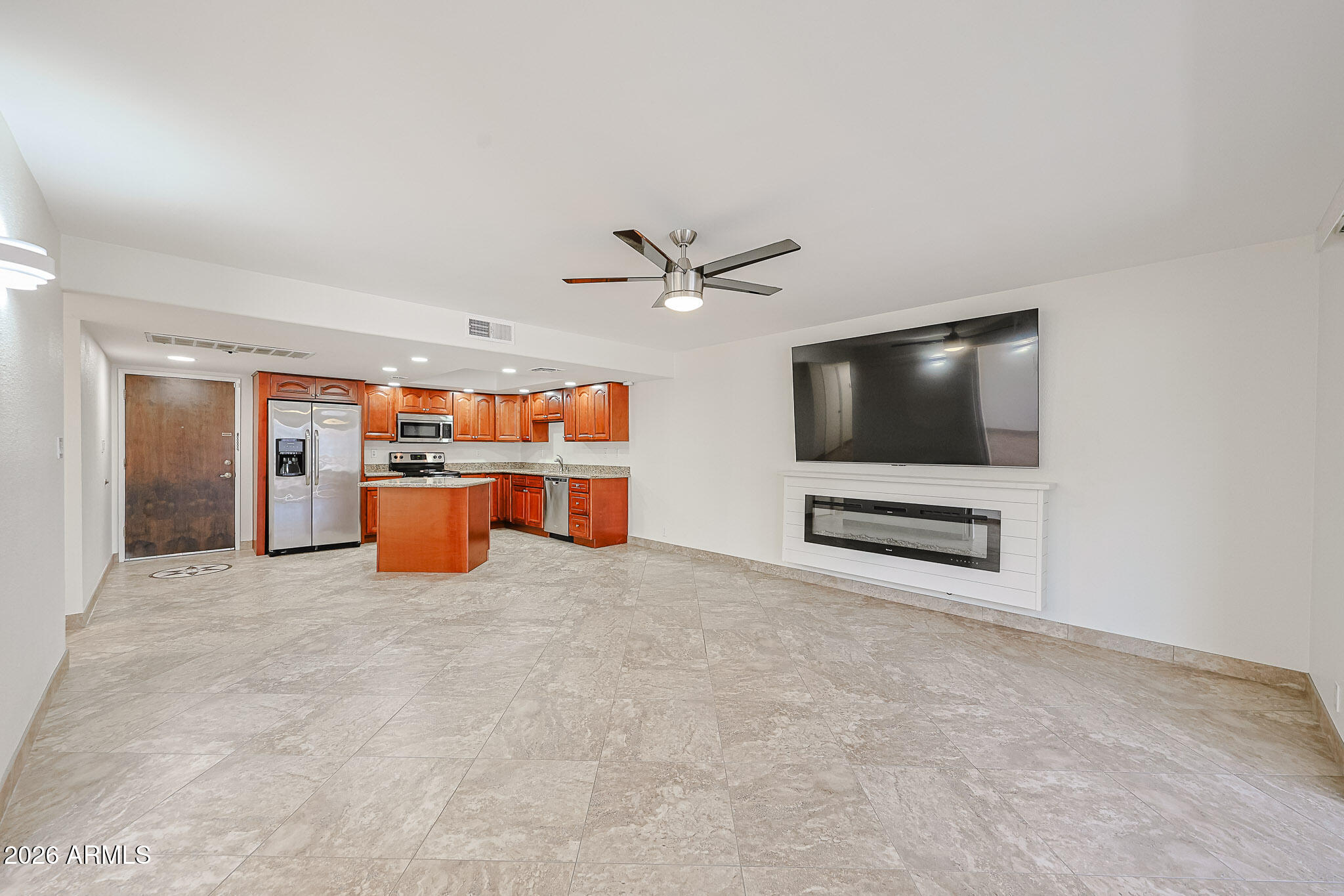 7920 East Camelback Road, Unit 111 Scottsdale, AZ 85251 - Photo 9 of 32 a living room with furniture and a flat screen tv