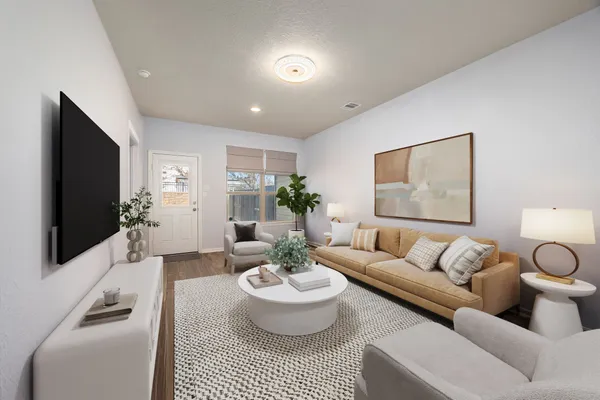 a living room with furniture and a flat screen tv
