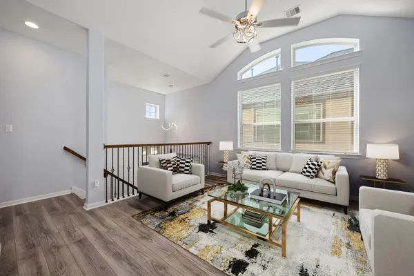 a living room with furniture and a window