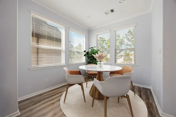 a view of a dining room with furniture window and outside view