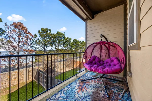 a view of a balcony with a potted plant