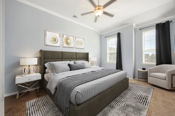 a bedroom with a large bed and a couch