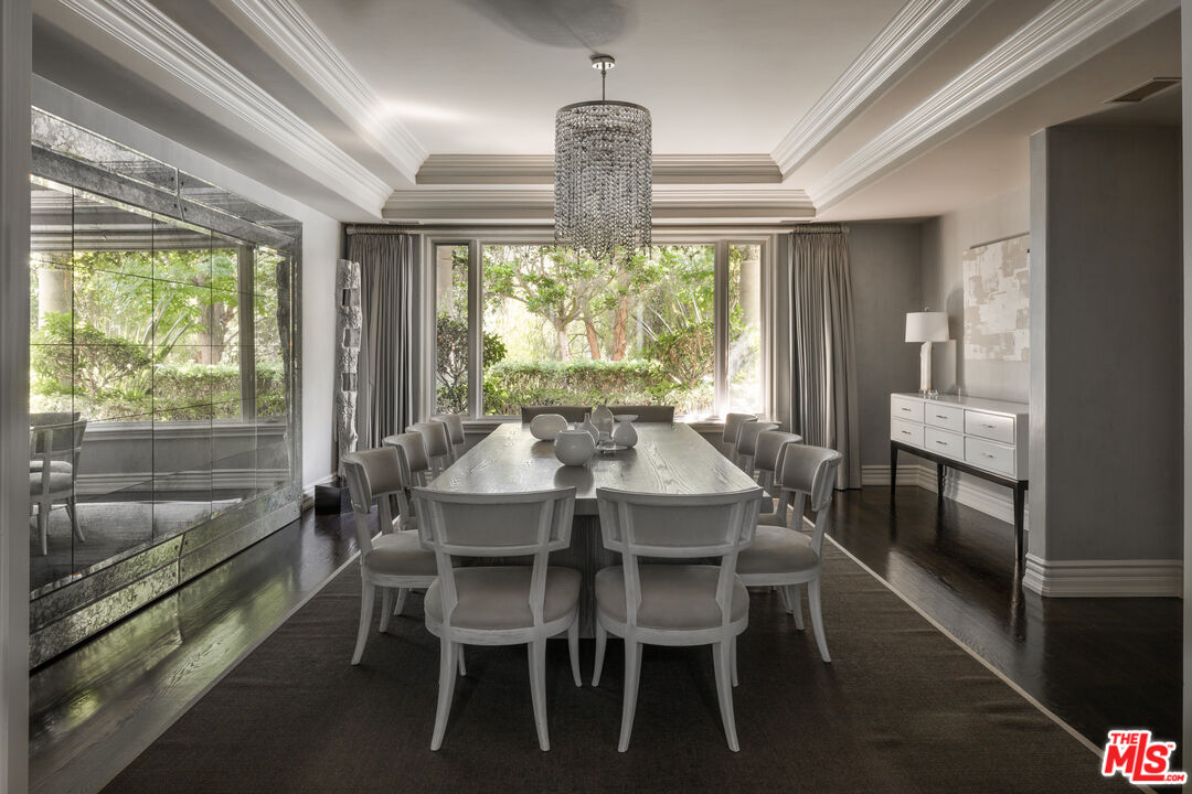 11972 Lockridge Road Studio City, CA 91604 - Photo 11 of 29 a dining room with furniture a chandelier and wooden floor