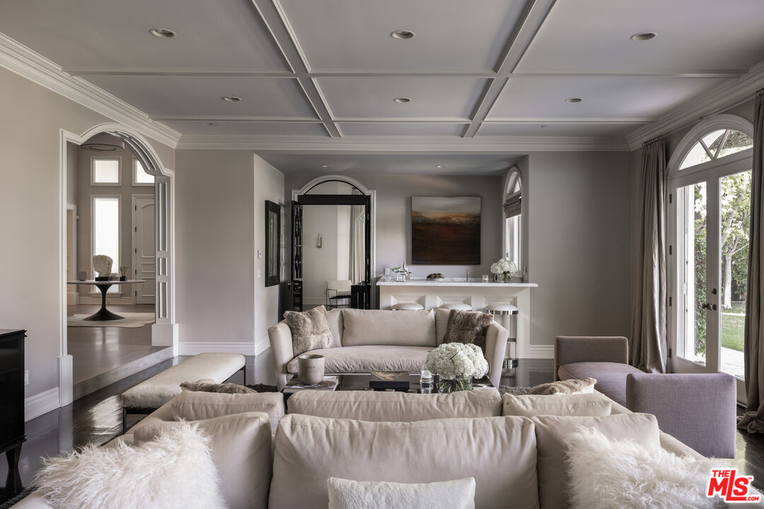 11972 Lockridge Road Studio City, CA 91604 - Photo 12 of 29 a living room with furniture and a flat screen tv