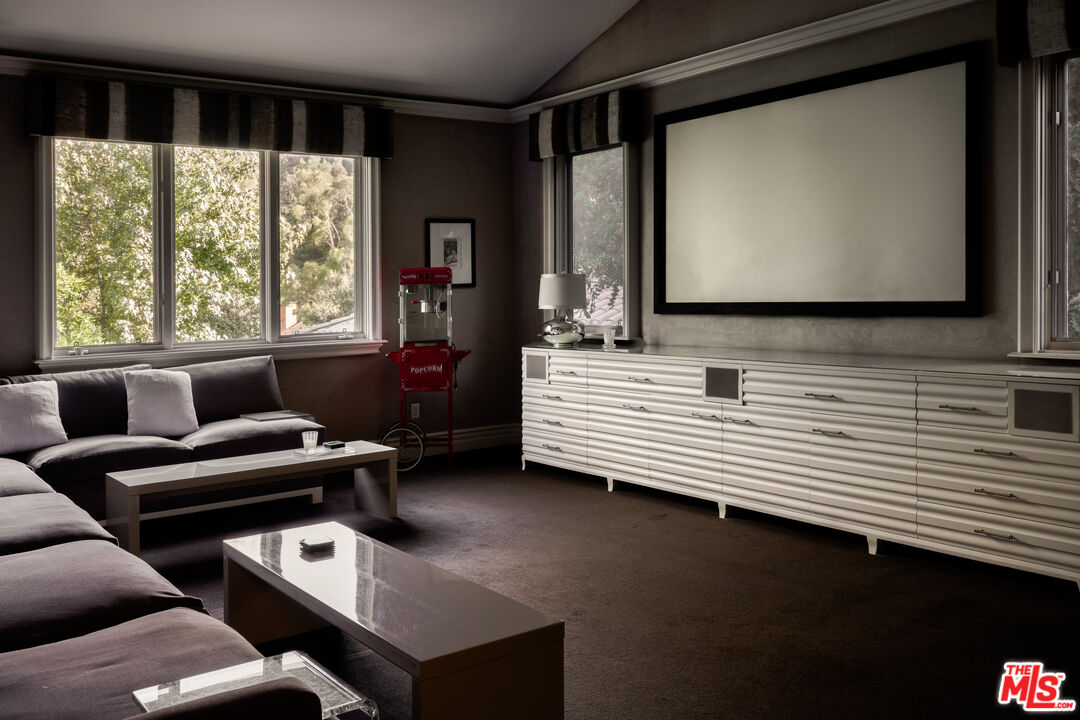 11972 Lockridge Road Studio City, CA 91604 - Photo 20 of 29 a living room with furniture and a flat screen tv