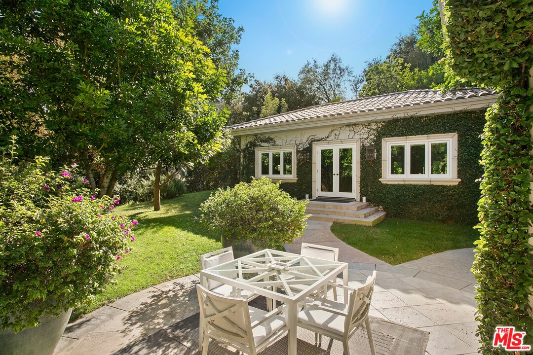 11972 Lockridge Road Studio City, CA 91604 - Photo 26 of 29 a front view of a house with garden