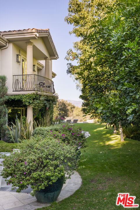 11972 Lockridge Road Studio City, CA 91604 - Photo 28 of 29 a view of a house with a yard