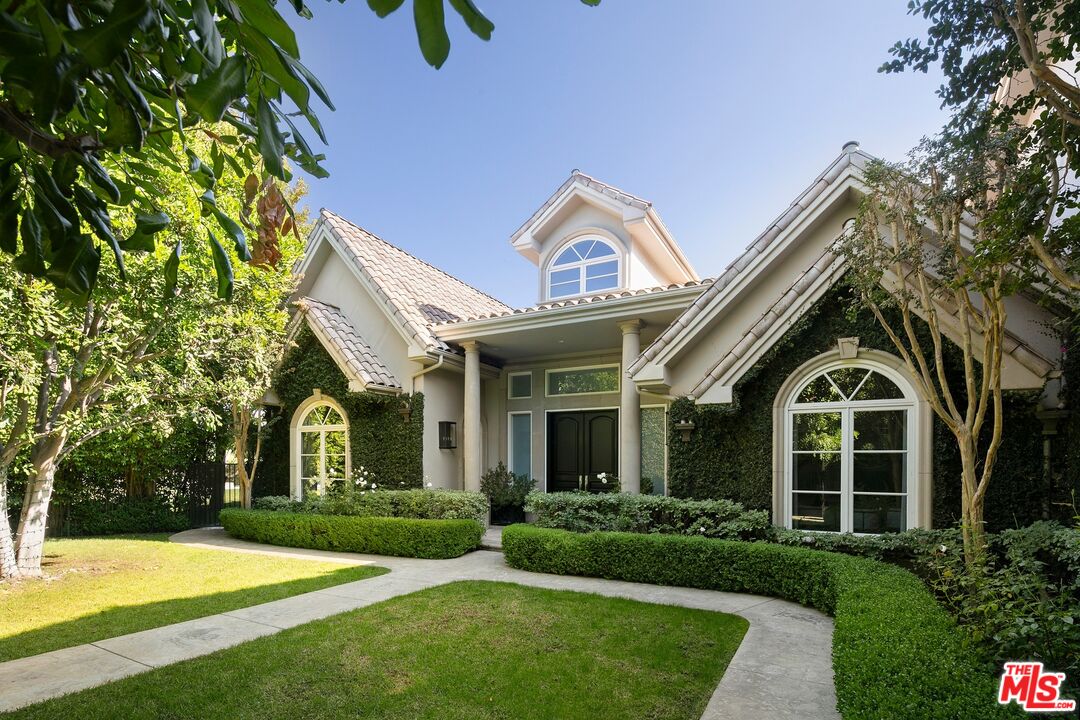 11972 Lockridge Road Studio City, CA 91604 - Photo 3 of 29 a view of a brick house with a yard