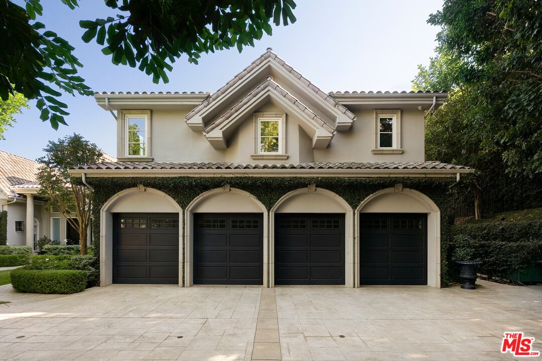 11972 Lockridge Road Studio City, CA 91604 - Photo 4 of 29 a front view of a house with garage