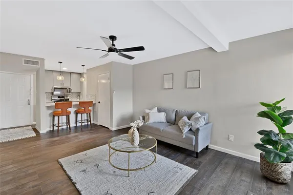 a living room with furniture and a table