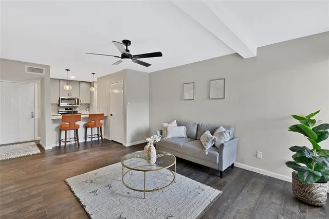a living room with furniture and a table