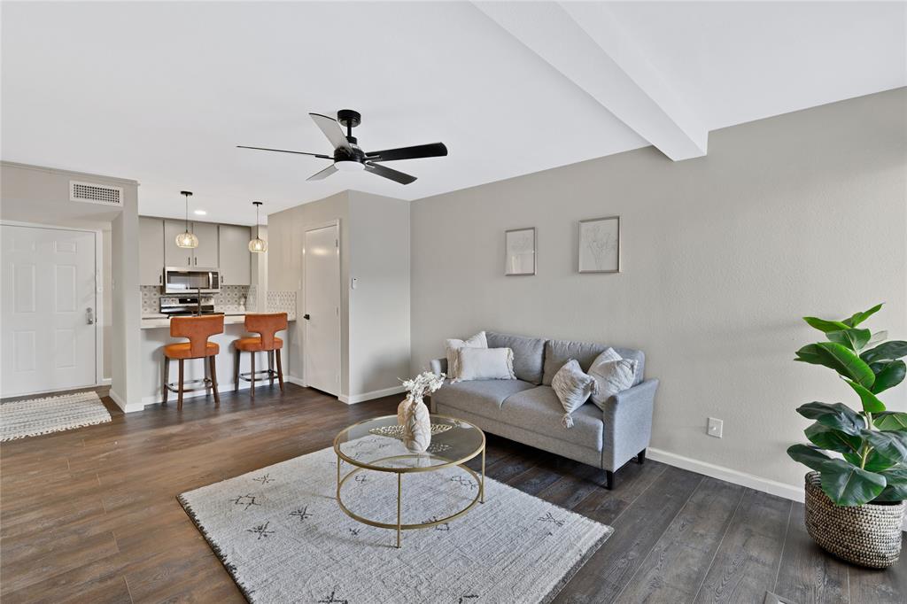 a living room with furniture and a table