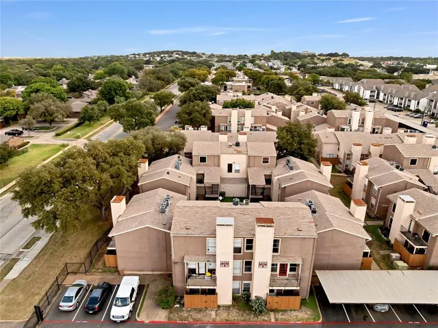 an aerial view of a city with lots of residential buildings