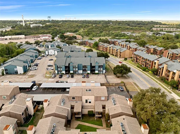 an aerial view of a city with lots of residential buildings