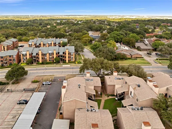 an aerial view of multiple house with outdoor space