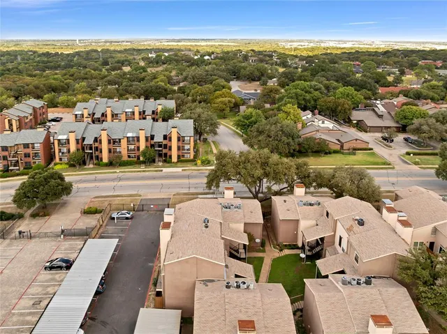 an aerial view of multiple house with outdoor space