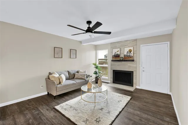 a living room with furniture and a fireplace