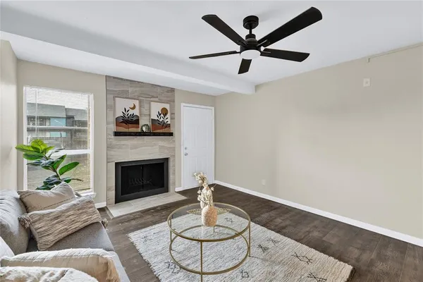 a kitchen with stainless steel appliances granite countertop a stove a sink and a wooden floor