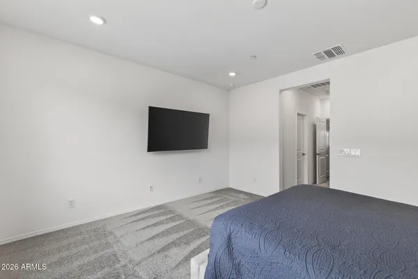 a kitchen with a sink chandelier and wooden floor