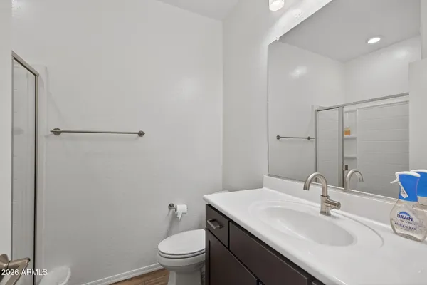 a bathroom with a glass shower door