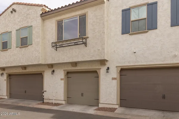 a room with gym equipment and windows