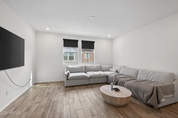 a view of a brick house with large windows