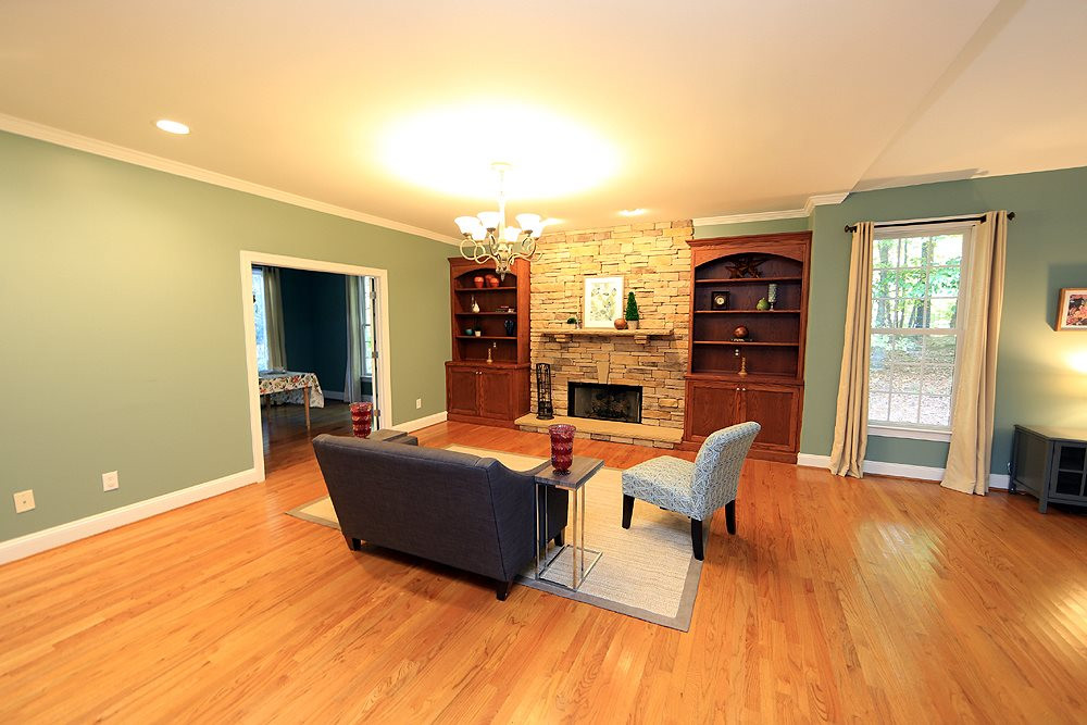 5921 Wild Orchid Trail Raleigh, NC 27613 - Photo 9 of 30 Beautiful built-ins flank the stacked stone fireplace. Family Room