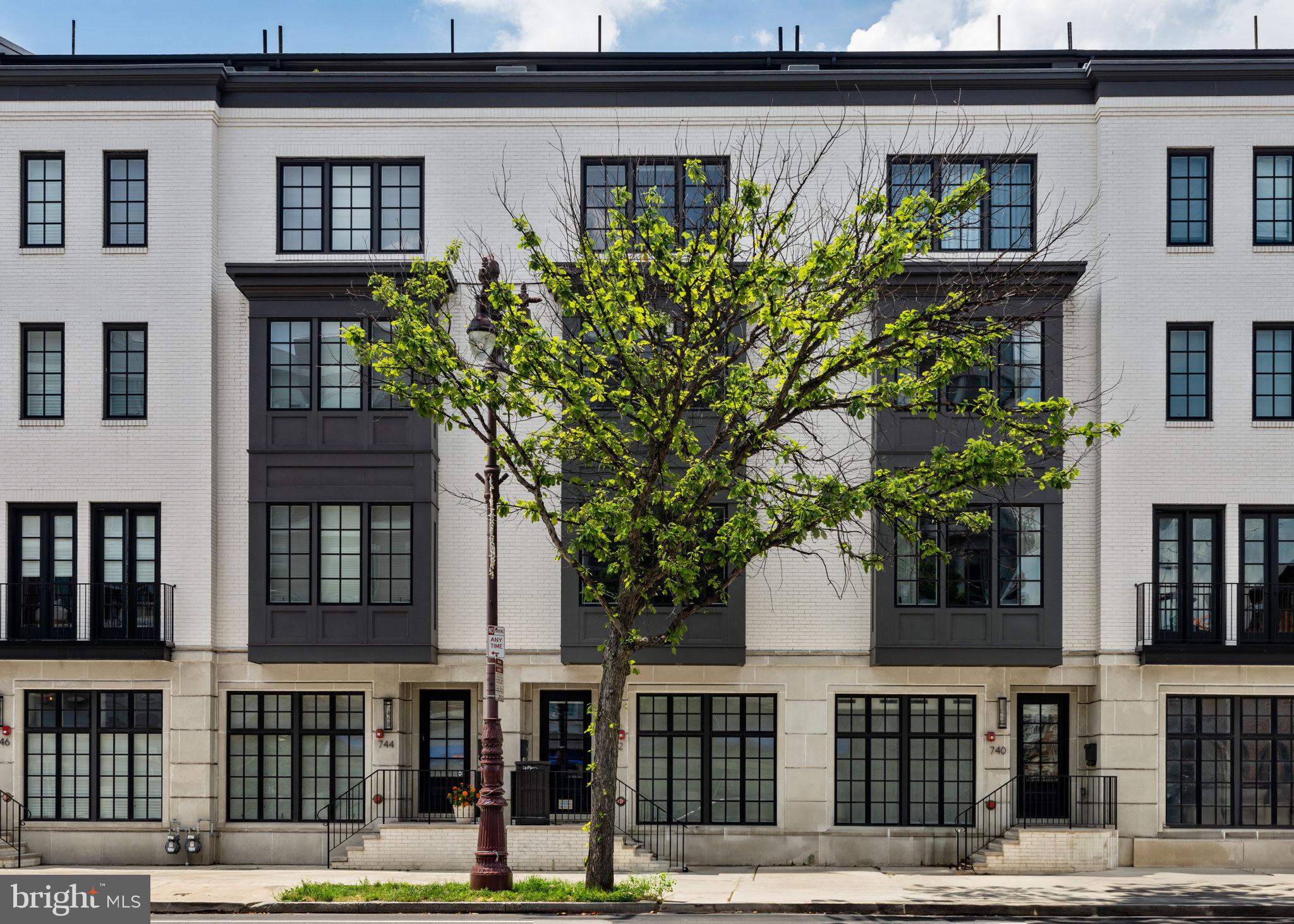 a front view of a building with garden